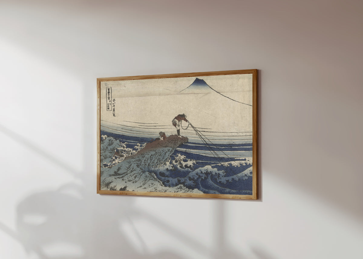 Framed art print of Thirty-six Views of Mount Fuji: Kajikazawa in… by Katsushika Hokusai, in a light wood frame on a sunlit white wall, seen at a slight angle