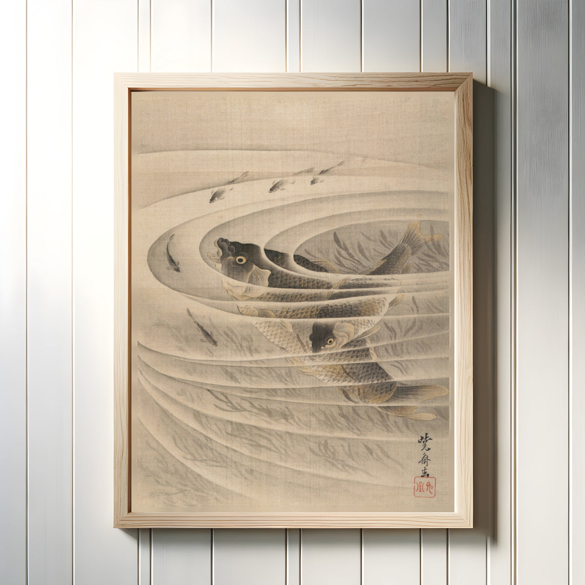 Framed art print of Carp (Koi-zu) by Kawanabe Kyosai, in a light wood frame on a white panelled wall