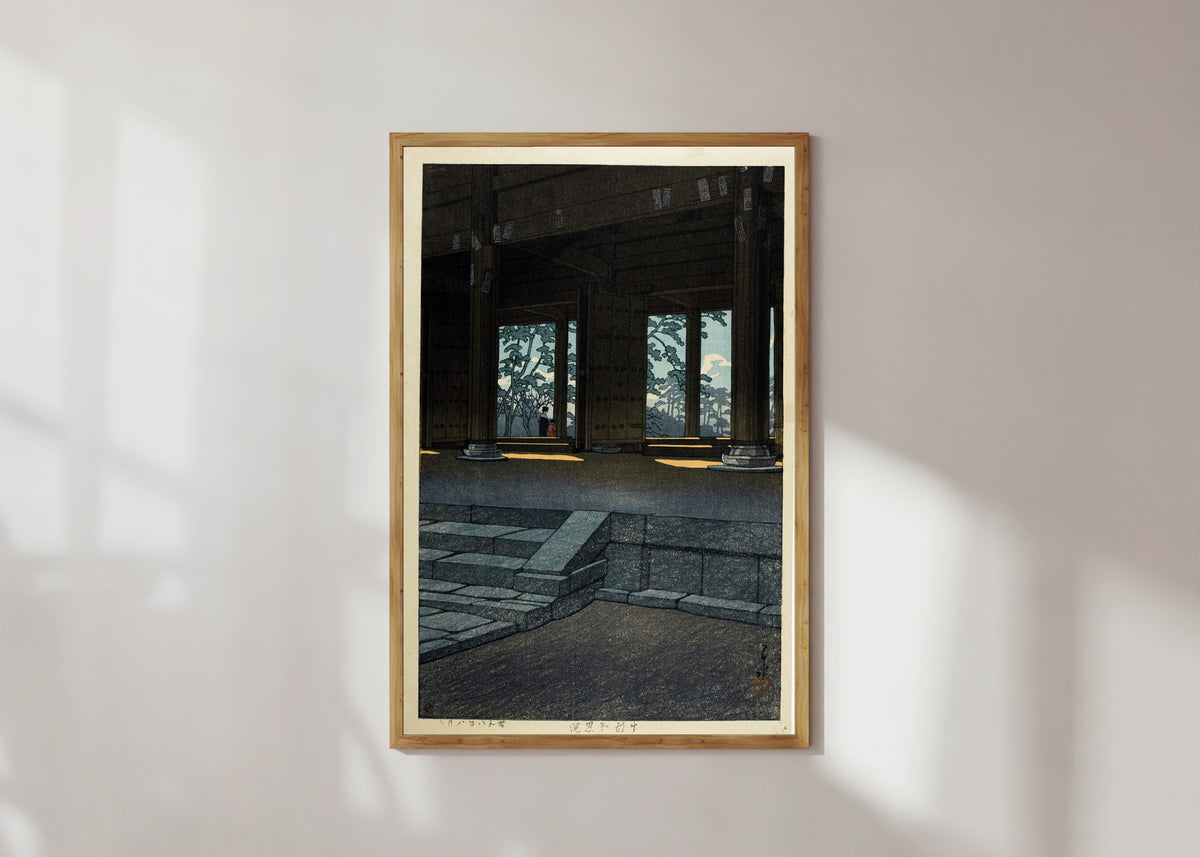 Framed art print of Chion Temple, Kyoto by Kawase Hasui, in a light wood frame on a sunlit white wall