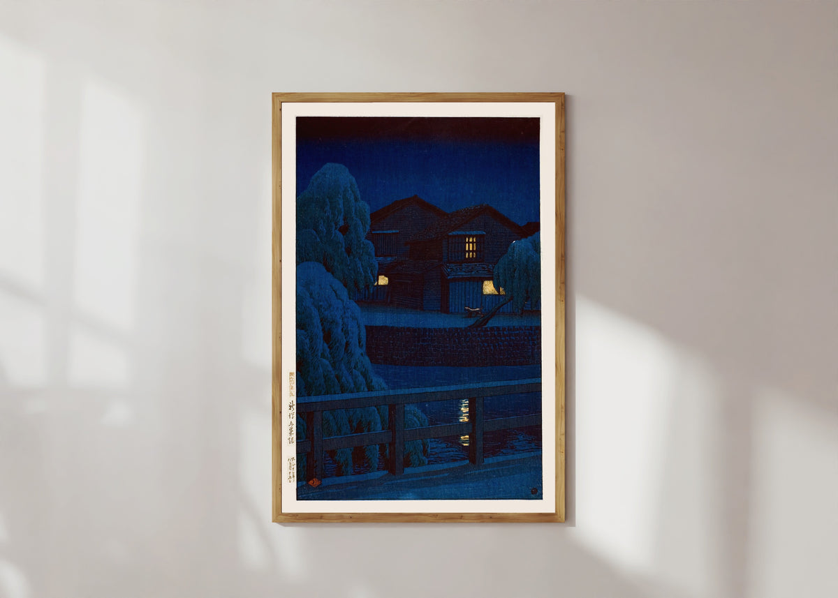 Framed art print of Gosai Canal, Niigata by Kawase Hasui, in a light wood frame on a sunlit white wall