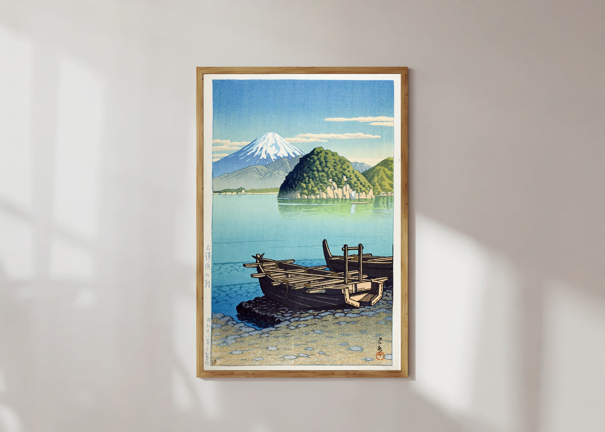 Framed art print of Morning at Miho Beach by Kawase Hasui, in a light wood frame on a sunlit white wall