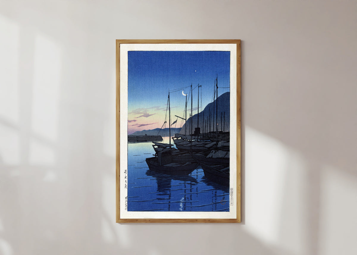 Framed art print of Morning in Beppu by Kawase Hasui, in a light wood frame on a sunlit white wall