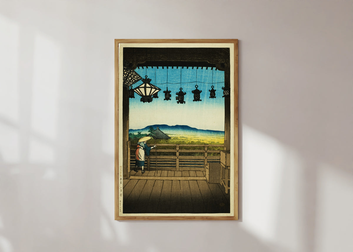 Framed art print of Nigatsu Hall in Nara by Kawase Hasui, in a light wood frame on a sunlit white wall
