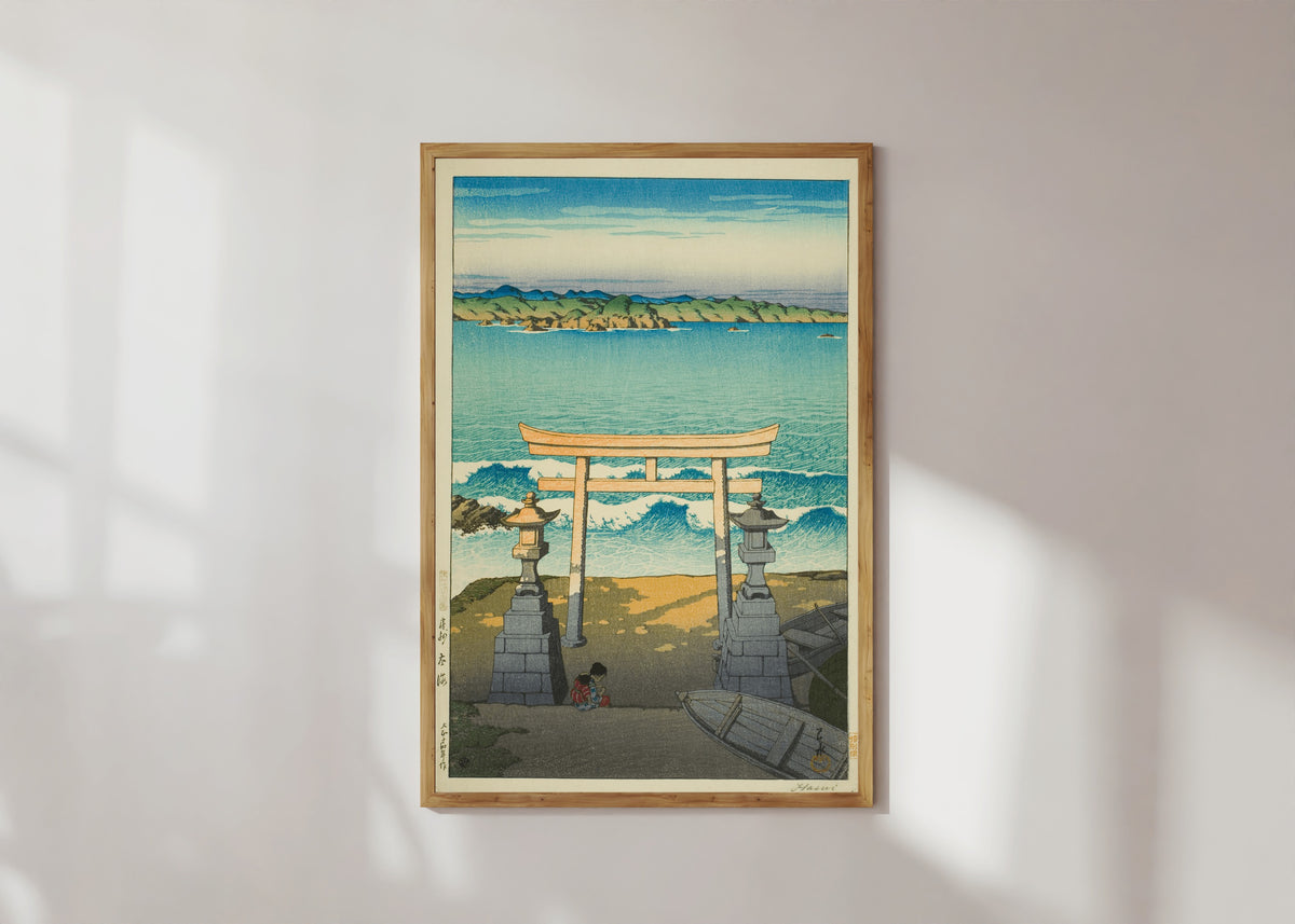 Framed art print of Pacific Ocean by Kawase Hasui, in a light wood frame on a sunlit white wall