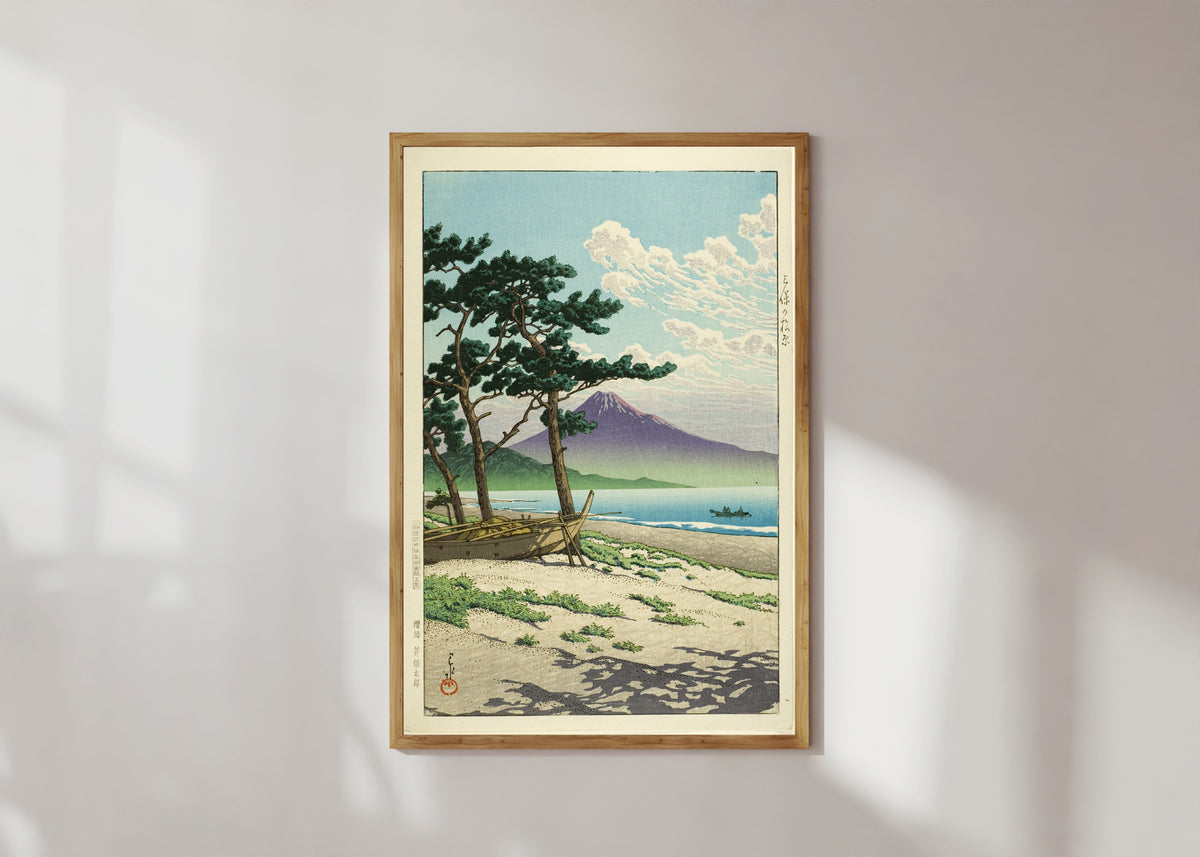 Framed art print of Pine Beach at Miho, Matsubara by Kawase Hasui, in a light wood frame on a sunlit white wall