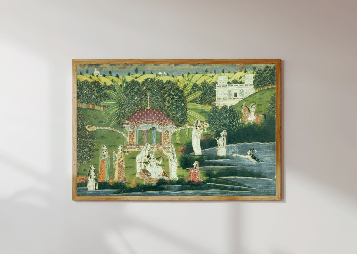 Framed art print of Bani Thani Bathing at Pholl Sagar Palace by Kishangarh school, in a light wood frame on a sunlit white wall