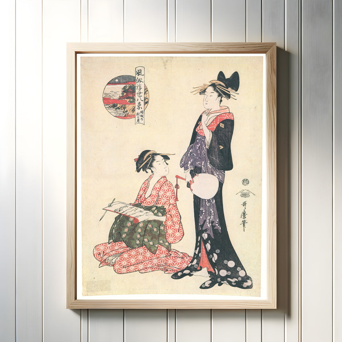Framed art print of Autumn Moon of the Courtesan, from Eight Fashionable Views by Kitagawa Utamaro, in a light wood frame on a white panelled wall