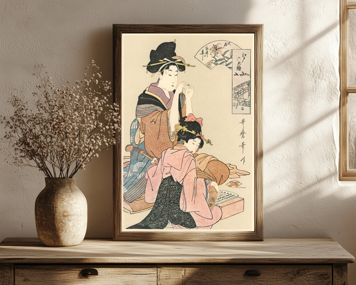 Framed art print of Six Beauties of Edo by Kitagawa Utamaro, in a dark wood frame leaning on a rustic console beside dried flowers
