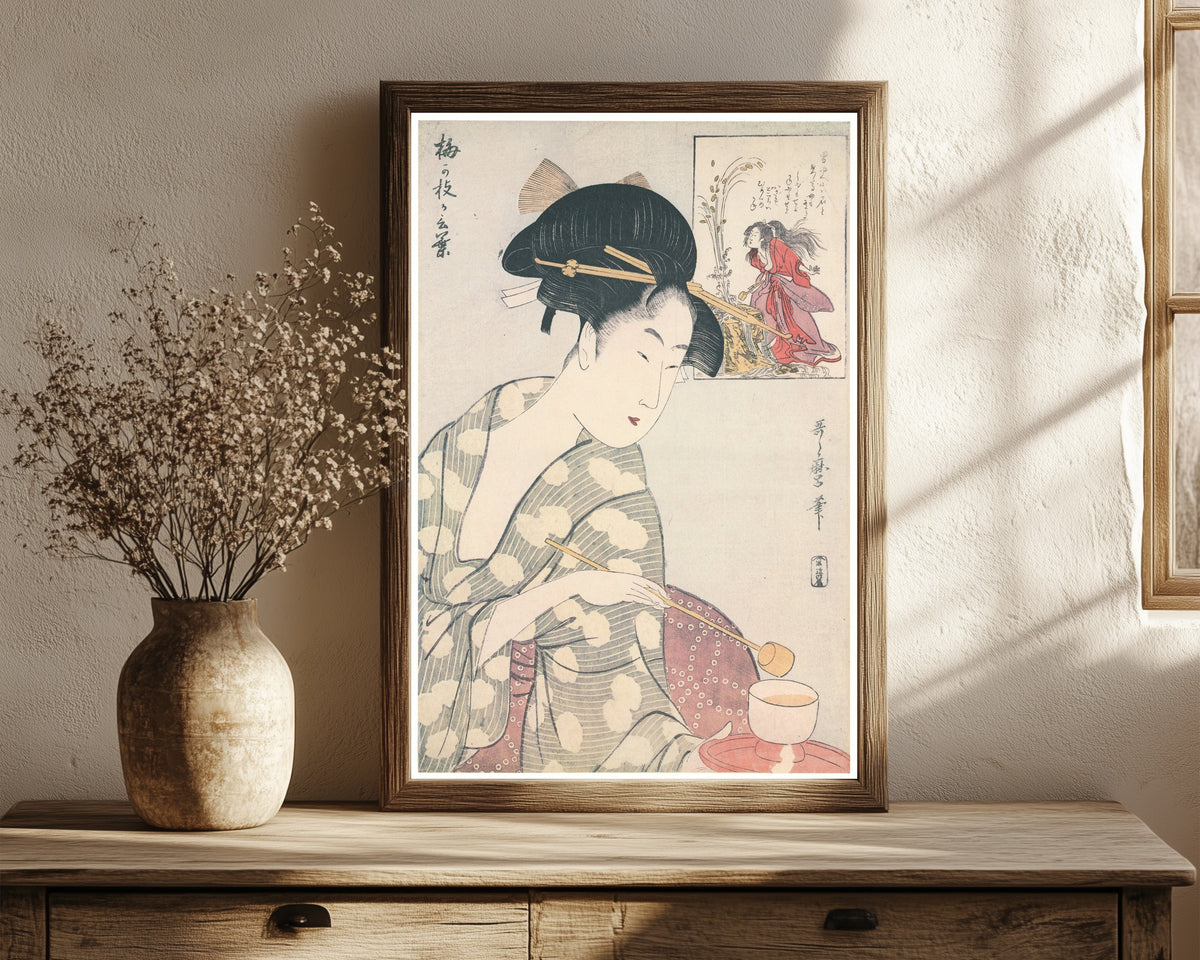 Framed art print of Umegae's Words by Kitagawa Utamaro, in a dark wood frame leaning on a rustic console beside dried flowers