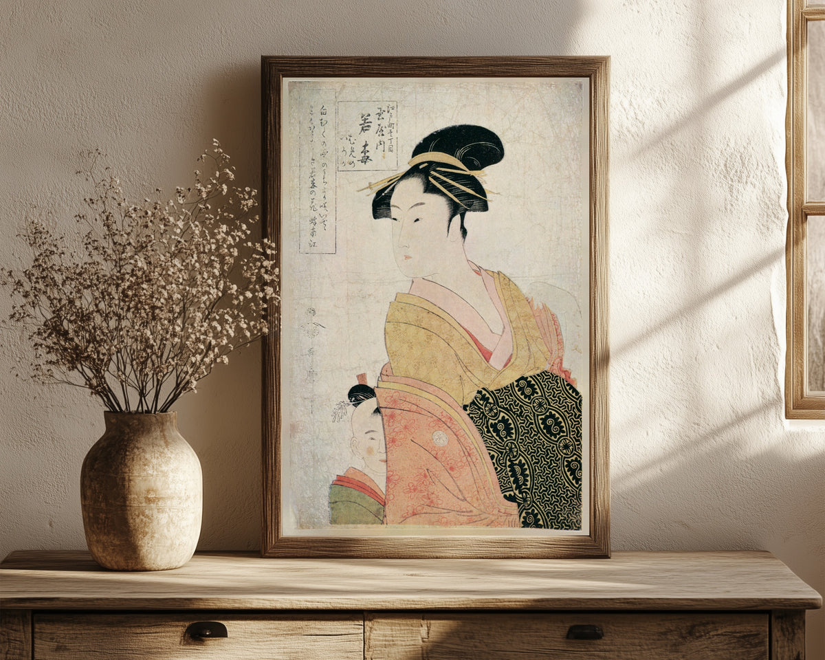 Framed art print of Wakaume of Tamaya, Edo-machi Itchome by Kitagawa Utamaro, in a dark wood frame leaning on a rustic console beside dried flowers