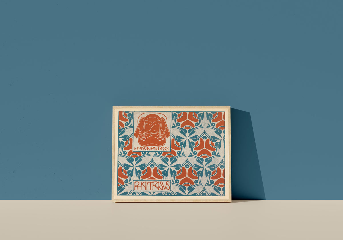 Framed art print of Bodenbelag Phantasus (Phantasus Floor Covering) by Koloman Moser, in a light wood frame leaning on a blue wall