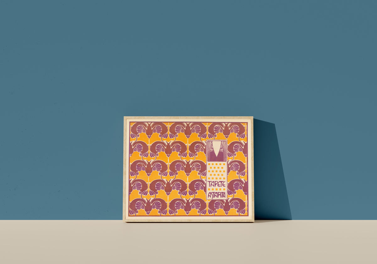 Framed art print of Tapete Astarta (Astarta Wallpaper) by Koloman Moser, in a light wood frame leaning on a blue wall