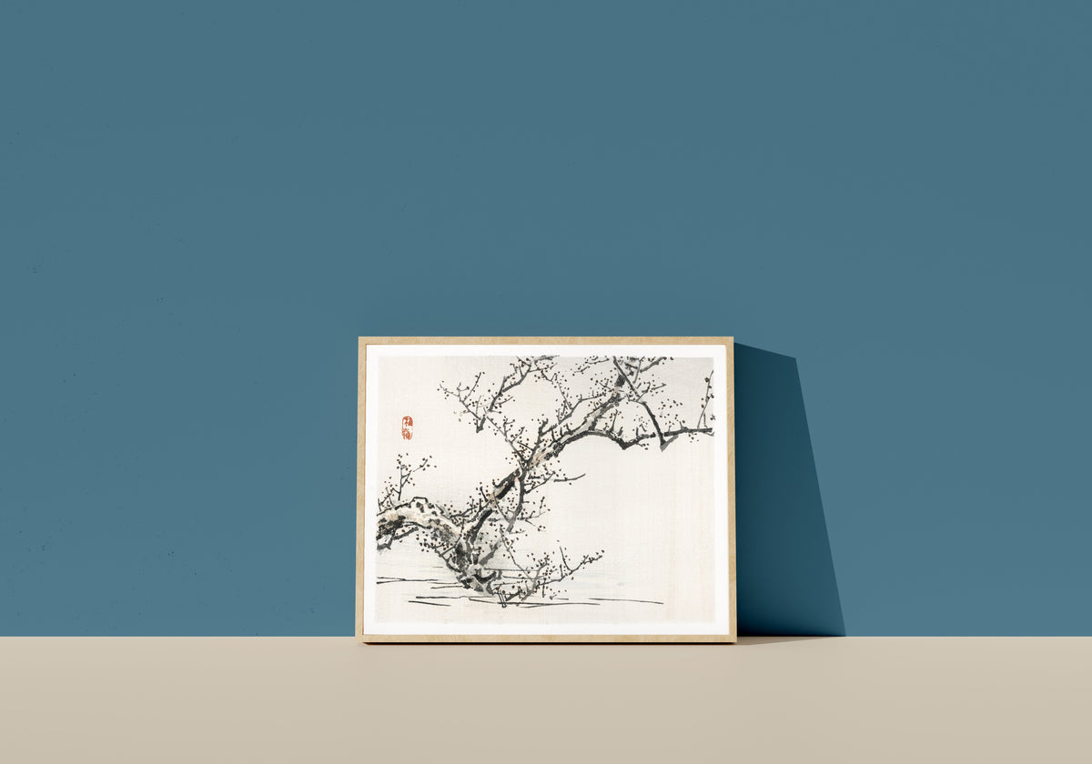 Framed art print of Tree against the backdrop of water by Kōno Bairei, in a light wood frame leaning on a blue wall