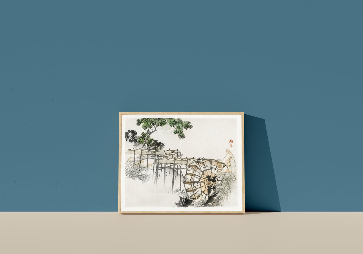 Framed art print of Water wheel (Bairei Gakan) by Kōno Bairei, in a light wood frame leaning on a blue wall