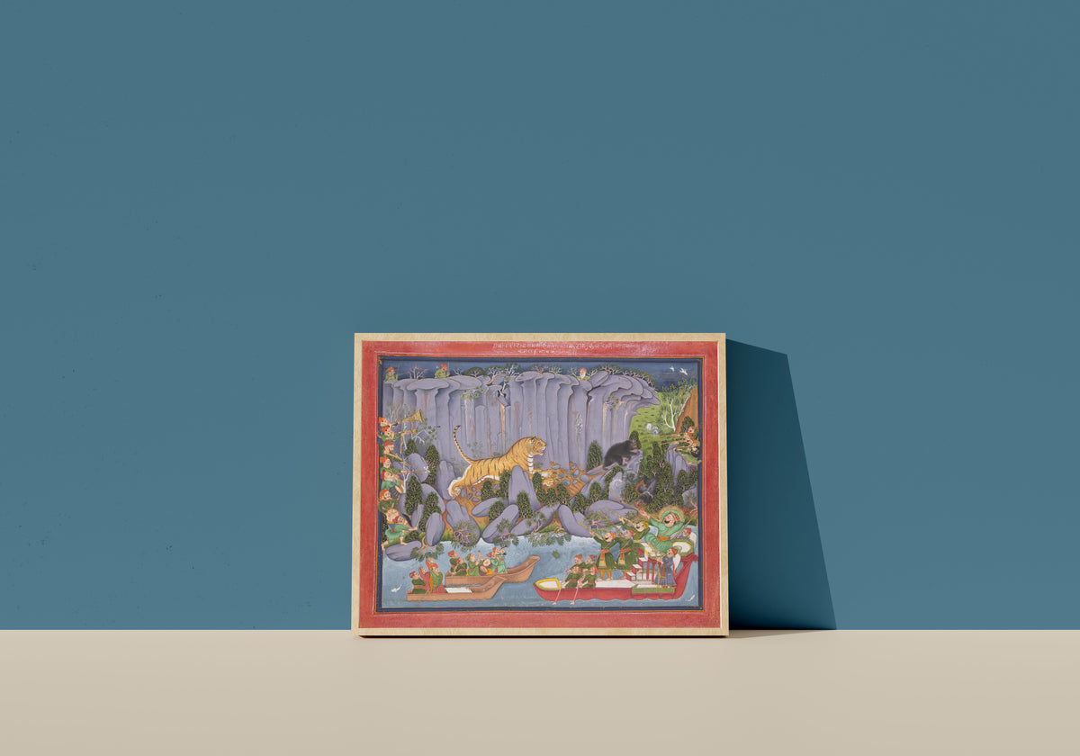 Framed art print of Tiger Hunt of Ram Singh II (Hunting from a Boat) by Kota school, in a light wood frame leaning on a blue wall