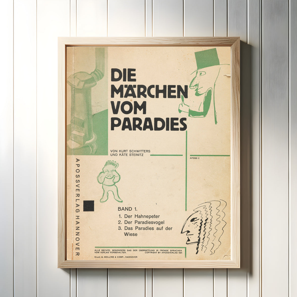 Framed art print of Die Märchen vom Paradies (Apossverlag, Band 1) by Kurt Schwitters, in a light wood frame on a white panelled wall