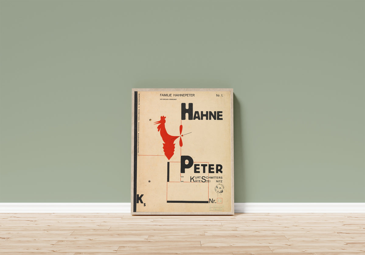 Framed art print of Hahne Peter by Kurt Schwitters, in a light wood frame leaning on a sage green wall above a wooden floor