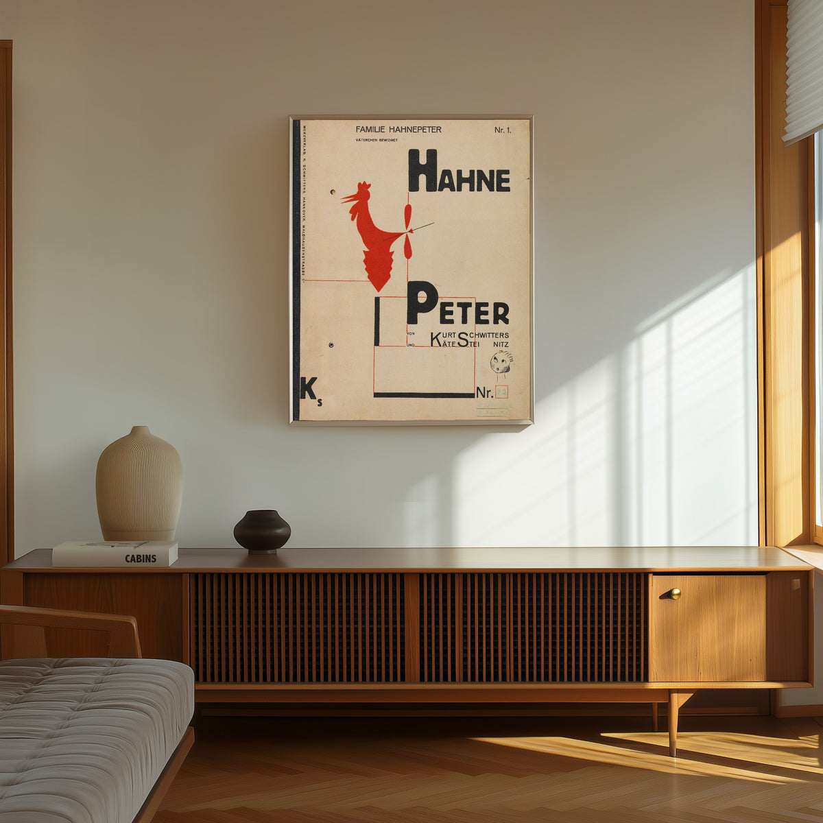 Framed art print of Hahne Peter by Kurt Schwitters, in a thin light frame on a sunlit wall above a wooden sideboard
