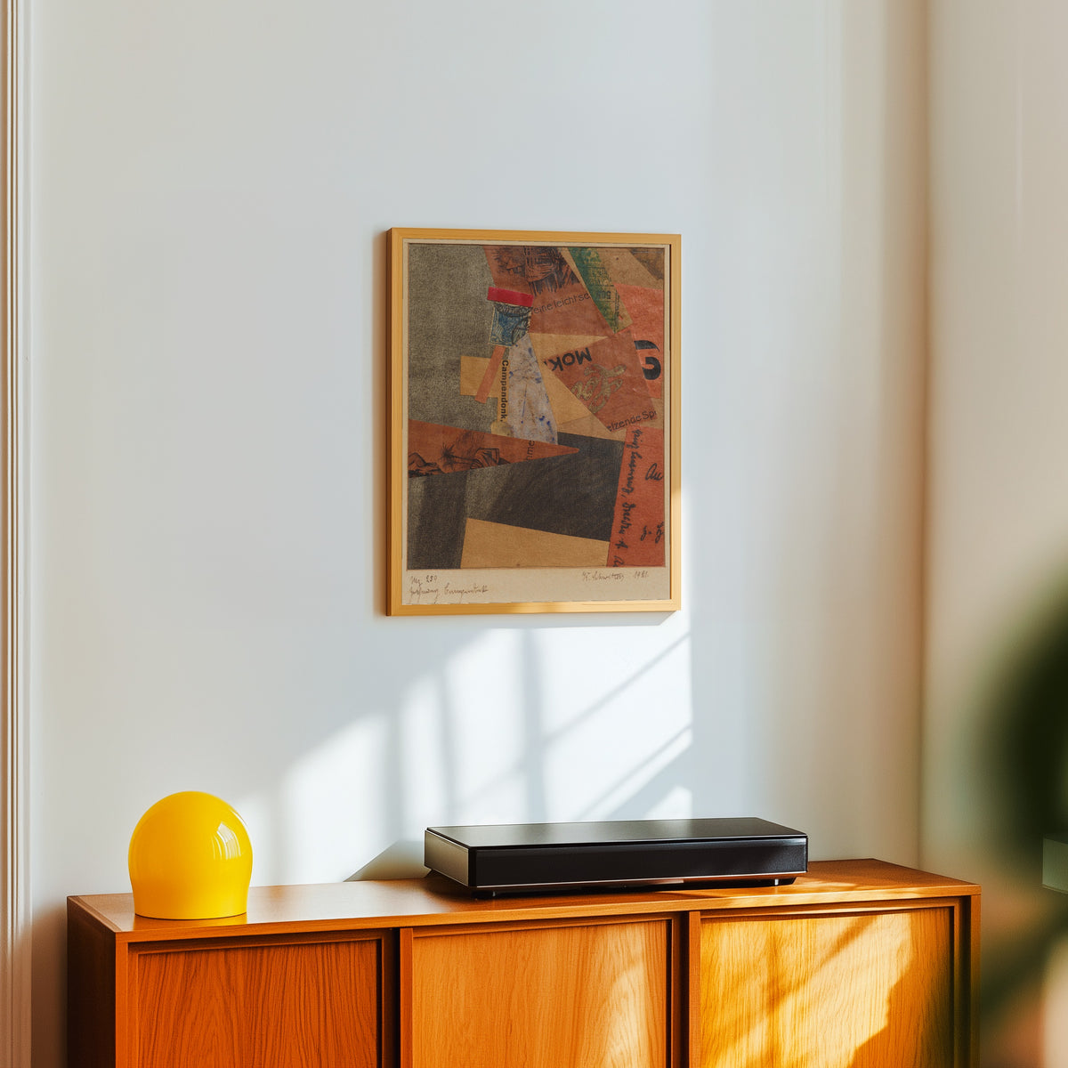 Framed art print of Mz 259 Zeichnung Campendonk by Kurt Schwitters, in a light wood frame on a white wall above an orange sideboard