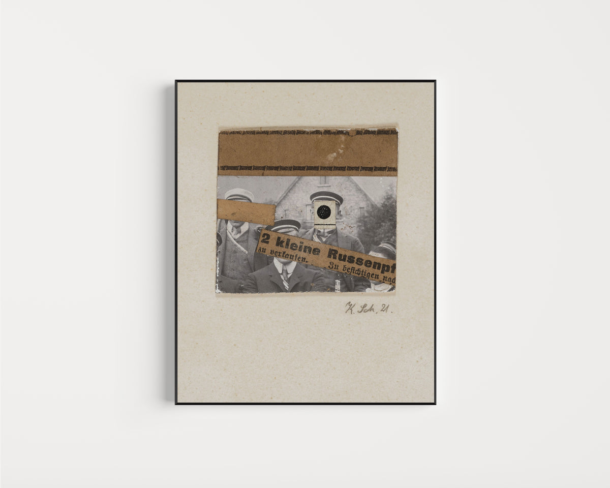 Framed art print of Ohne titel (2 kleine Russenpf) by Kurt Schwitters, in a slim black frame on a plain white wall