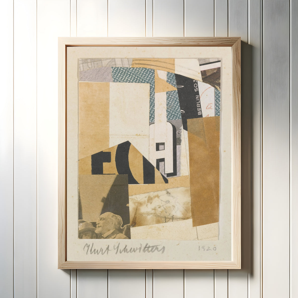 Framed art print of Ohne Titel, Berlin S 03 (Untitled, Berlin S 03) by Kurt Schwitters, in a light wood frame on a white panelled wall