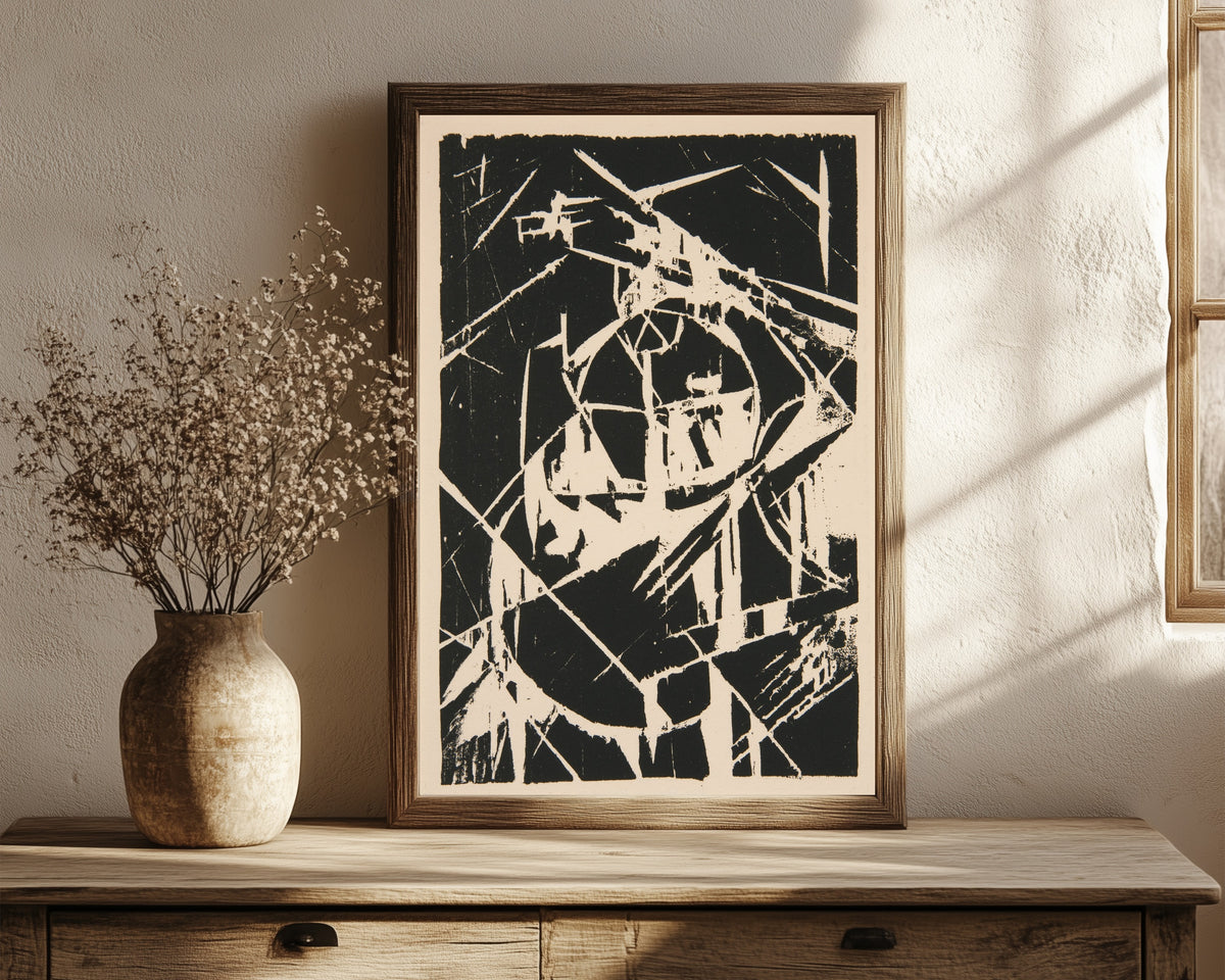 Framed art print of Plate XII from Das Kestnerbuch by Kurt Schwitters, in a dark wood frame leaning on a rustic console beside dried flowers
