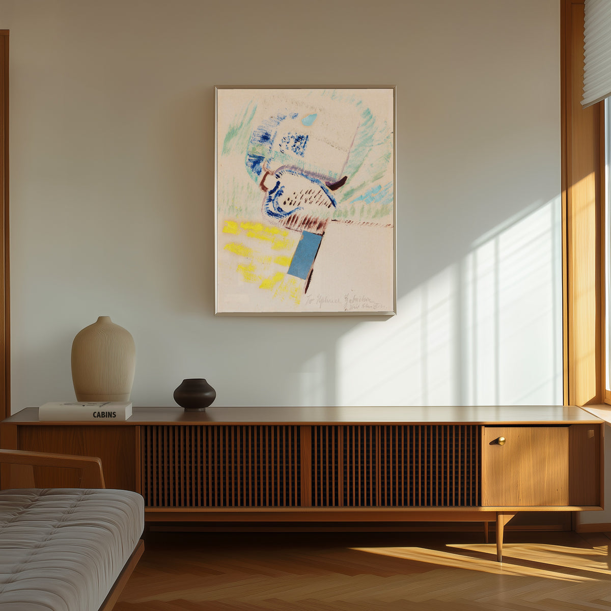 Framed art print of To Hjalmar Gabrielson. Merzzeichnung by Kurt Schwitters, in a thin light frame on a sunlit wall above a wooden sideboard