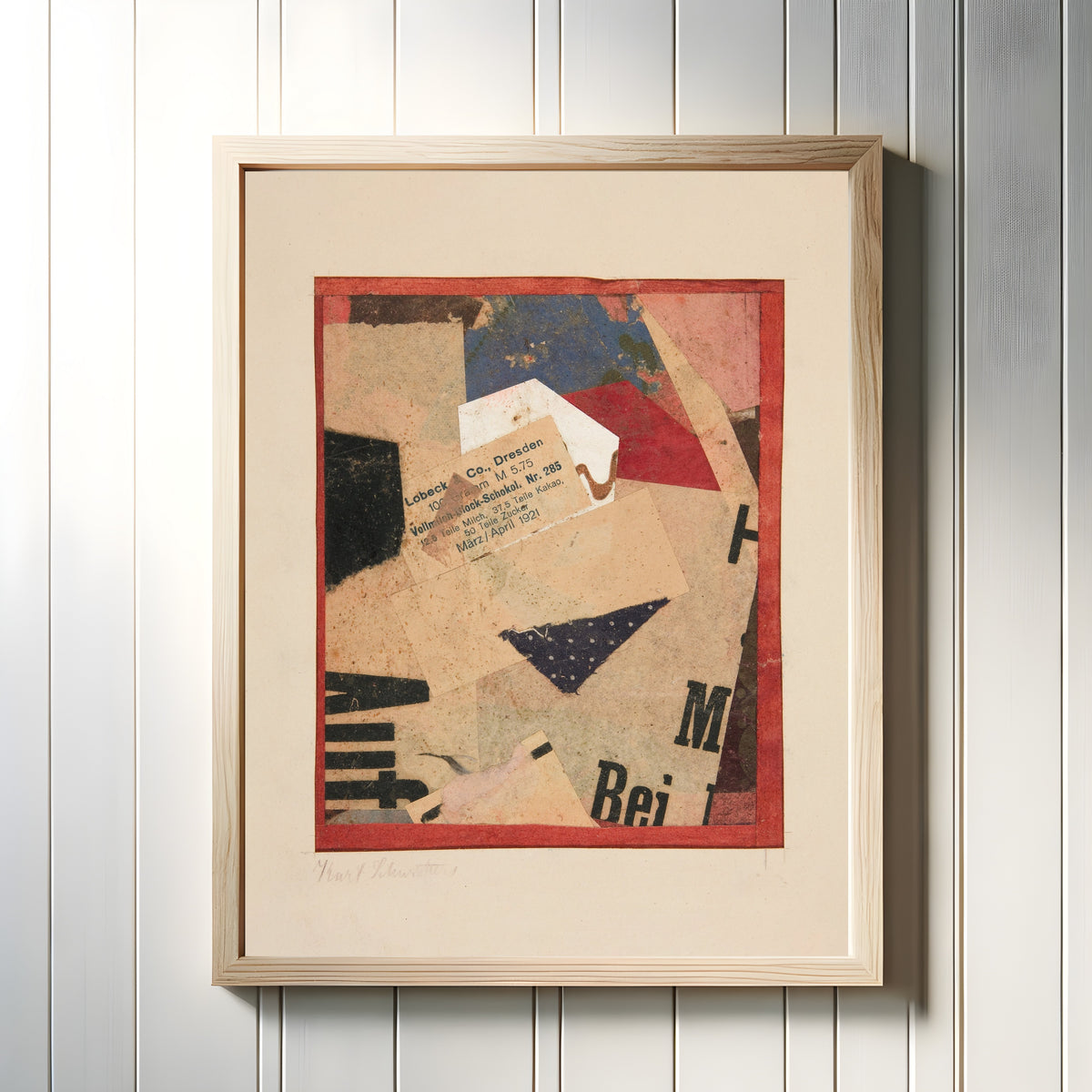 Framed art print of Untitled [Lobeck & Co., Dresden] by Kurt Schwitters, in a light wood frame on a white panelled wall