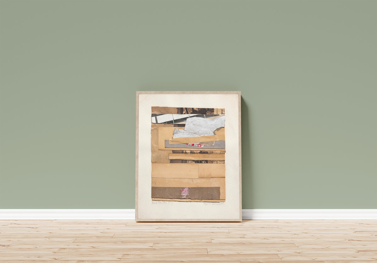 Framed art print of Wieder horizontal by Kurt Schwitters, in a light wood frame leaning on a sage green wall above a wooden floor