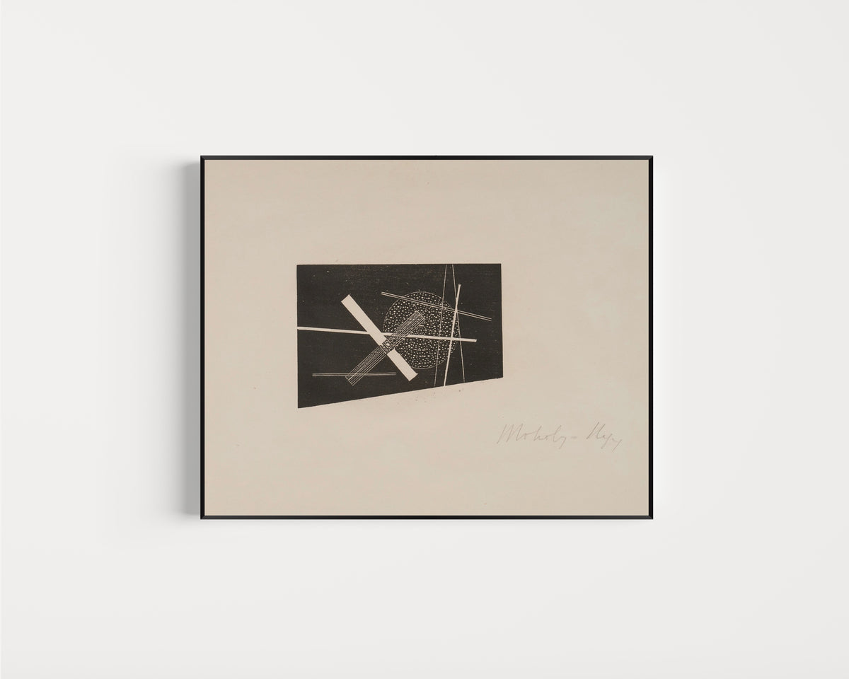 Framed art print of Composition (circa 1923) by László Moholy-Nagy, in a slim black frame on a plain white wall