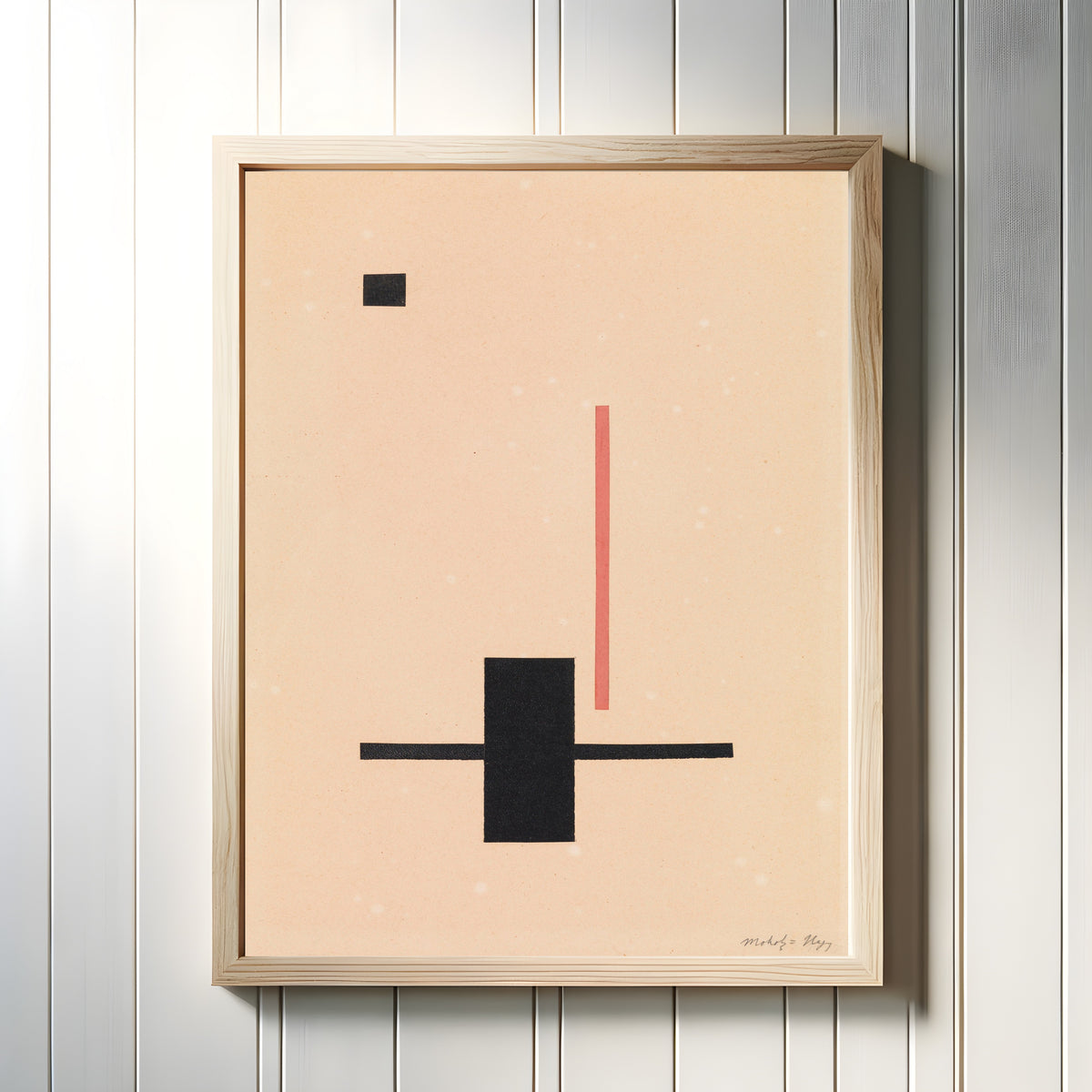 Framed art print of Composition by László Moholy-Nagy, in a light wood frame on a white panelled wall