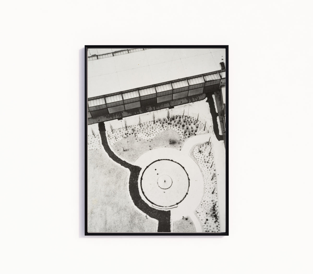 Framed art print of From the Radio Tower, Berlin by László Moholy-Nagy, in a slim black frame on a plain white wall