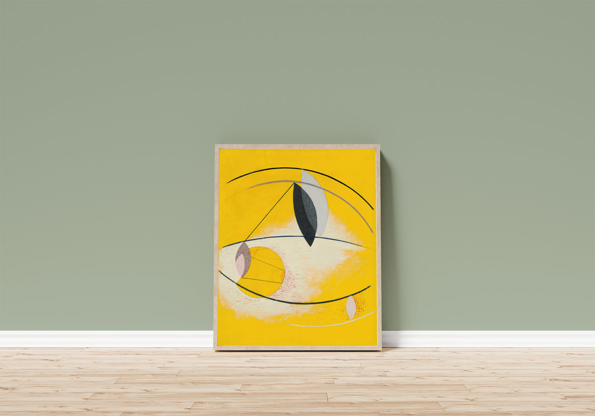 Framed art print of Gal Ab I by László Moholy-Nagy, in a light wood frame leaning on a sage green wall above a wooden floor