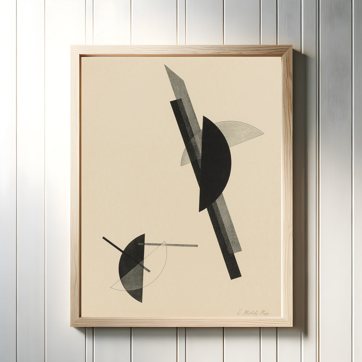 Framed art print of Kestnermappe, Komposition by László Moholy-Nagy, in a light wood frame on a white panelled wall