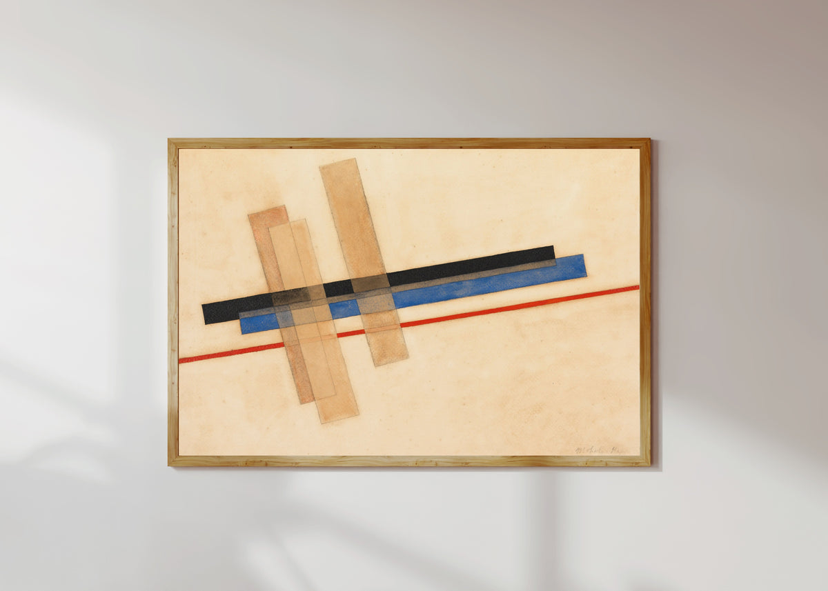 Framed art print of Komposition by László Moholy-Nagy, in a light wood frame on a sunlit white wall