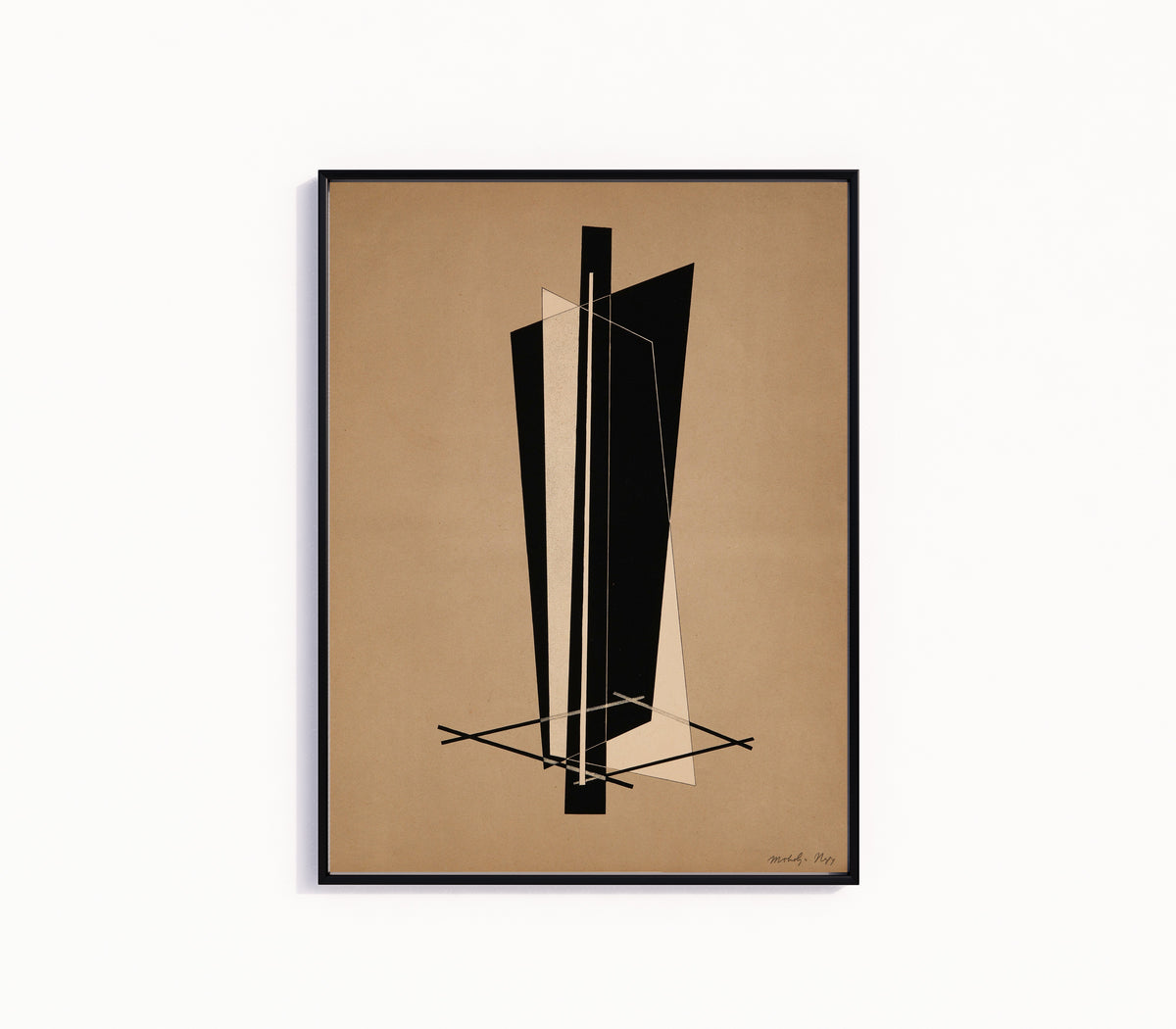 Framed art print of Konstruktion VI by László Moholy-Nagy, in a slim black frame on a plain white wall