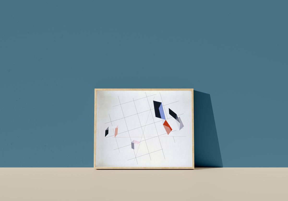 Framed art print of L IV by László Moholy-Nagy, in a light wood frame leaning on a blue wall