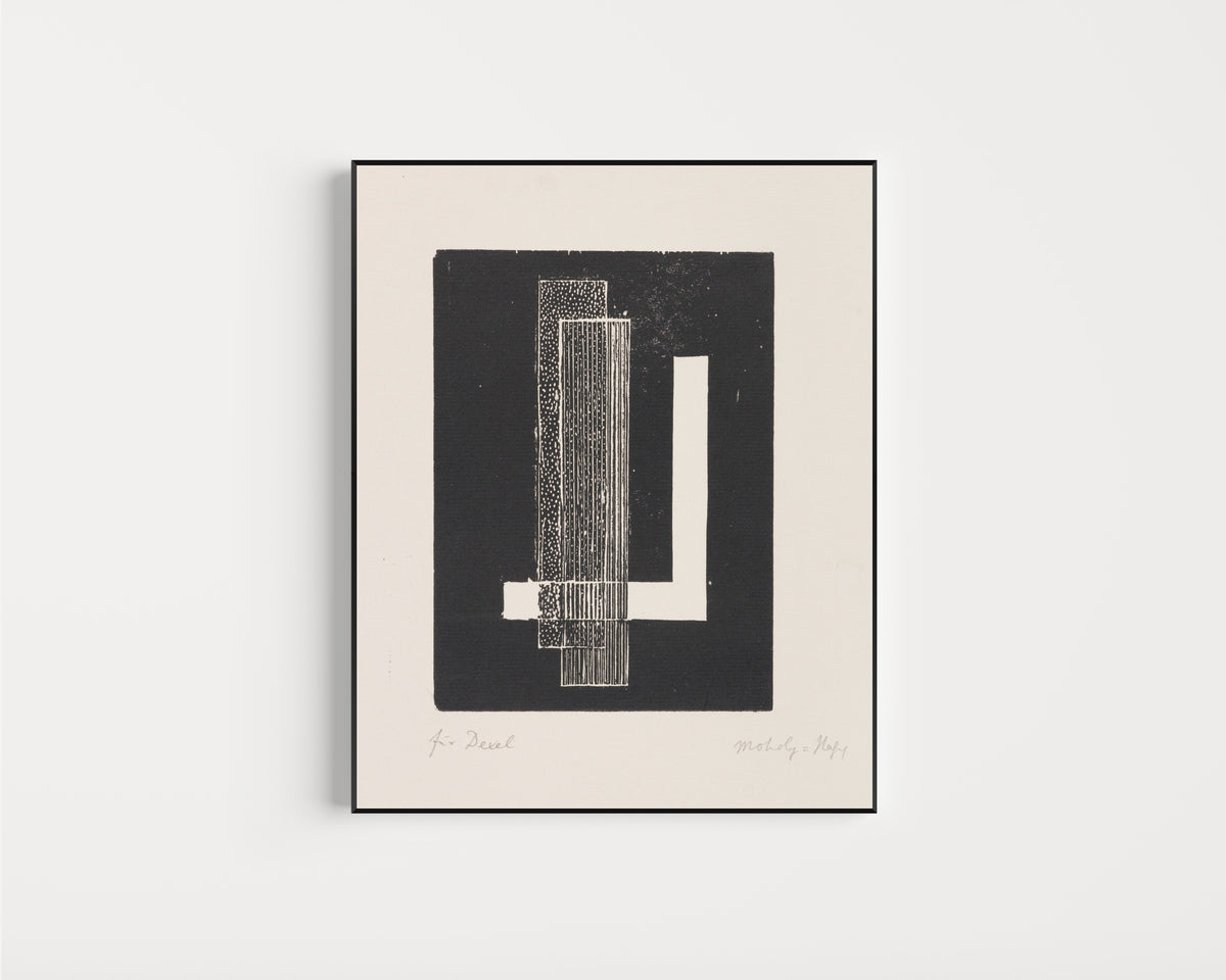 Framed art print of Ohne Titel by László Moholy-Nagy, in a slim black frame on a plain white wall