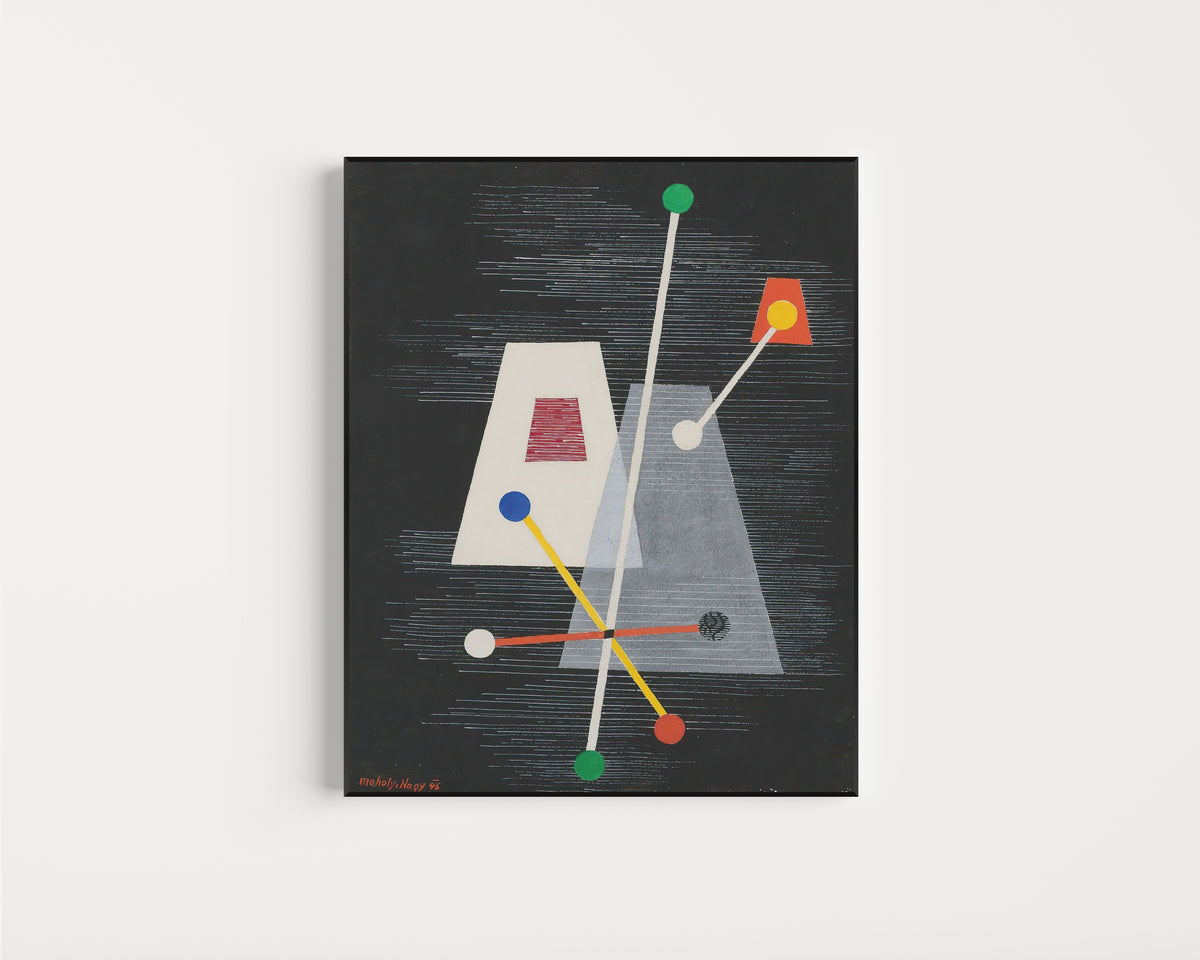 Framed art print of Truncated Pyramids by László Moholy-Nagy, in a slim black frame on a plain white wall
