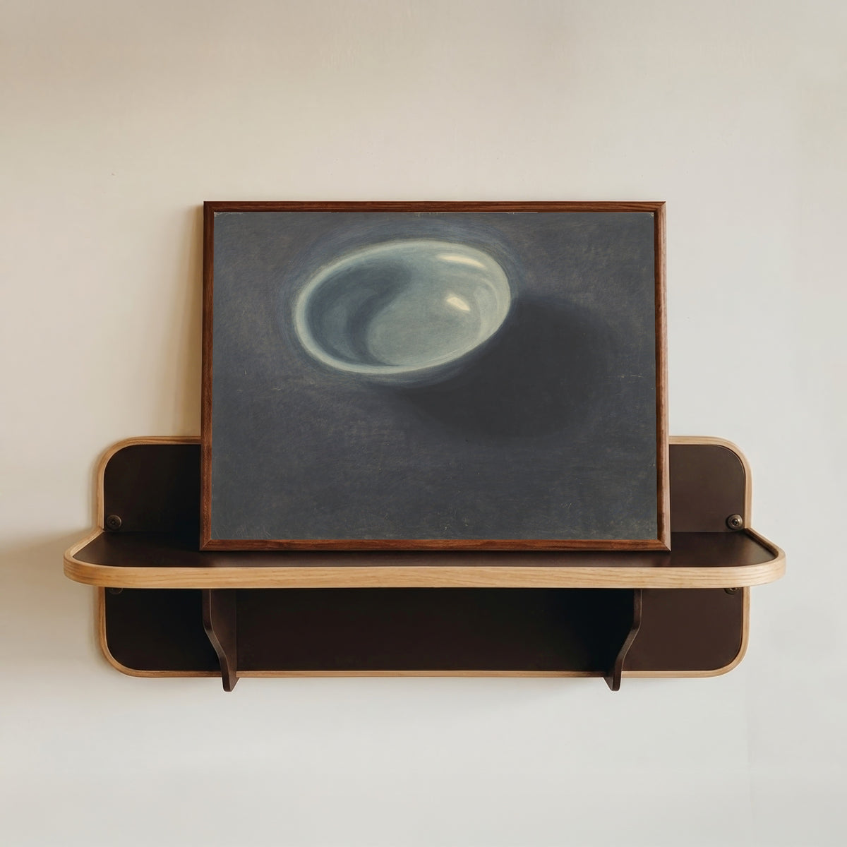 Framed art print of De blauwe teil by Léon Spilliaert, in a dark wood frame resting on a wall shelf