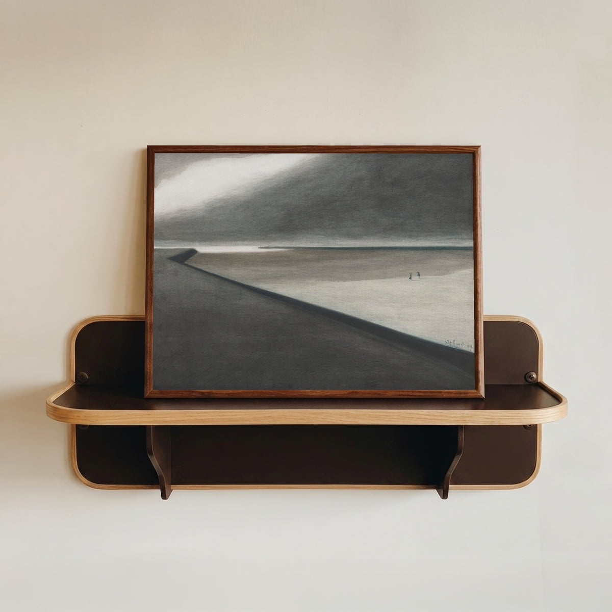 Framed art print of Digue et plage by Léon Spilliaert, in a dark wood frame resting on a wall shelf