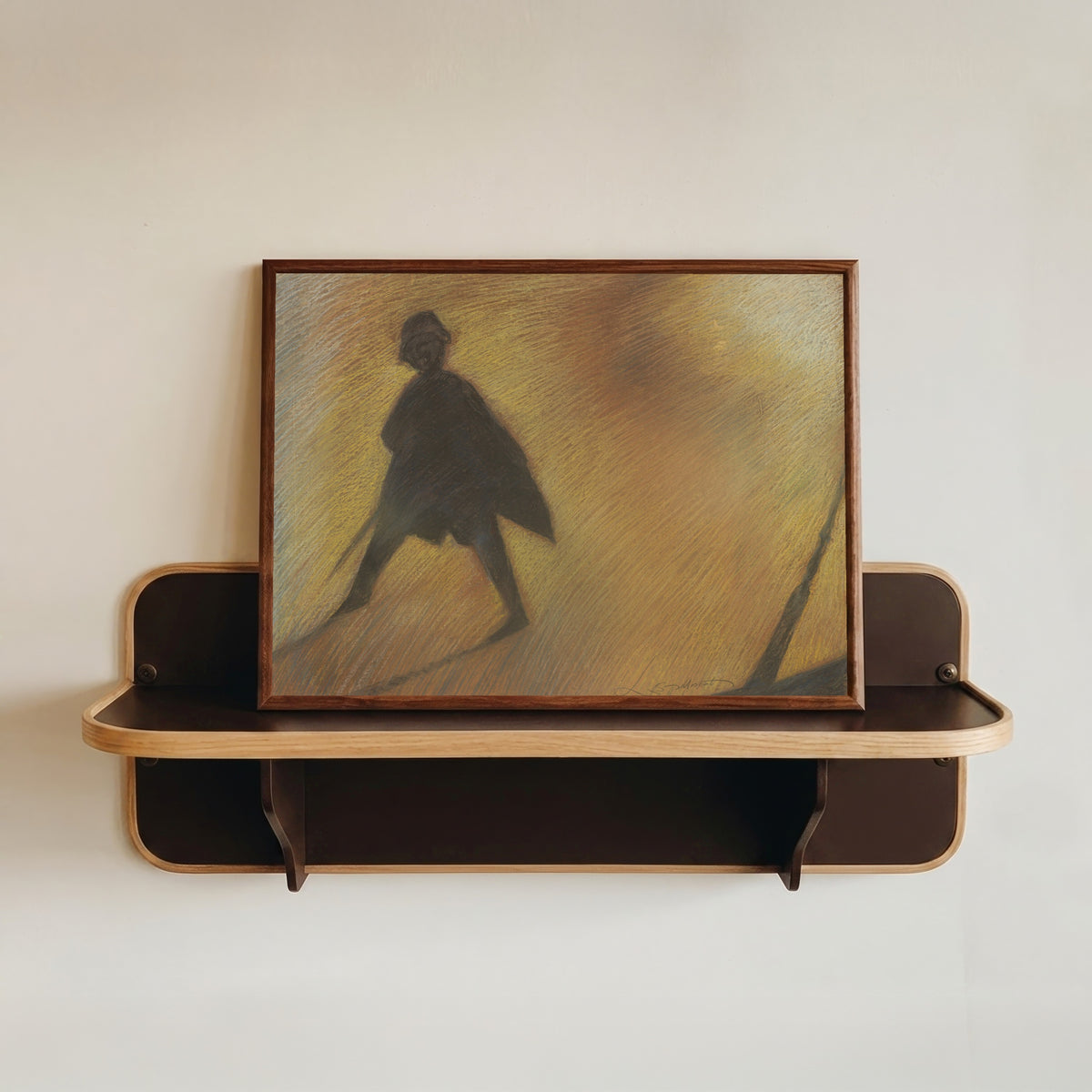 Framed art print of Het einde van een mooie dag – Figuur in tegenlicht by Léon Spilliaert, in a dark wood frame resting on a wall shelf