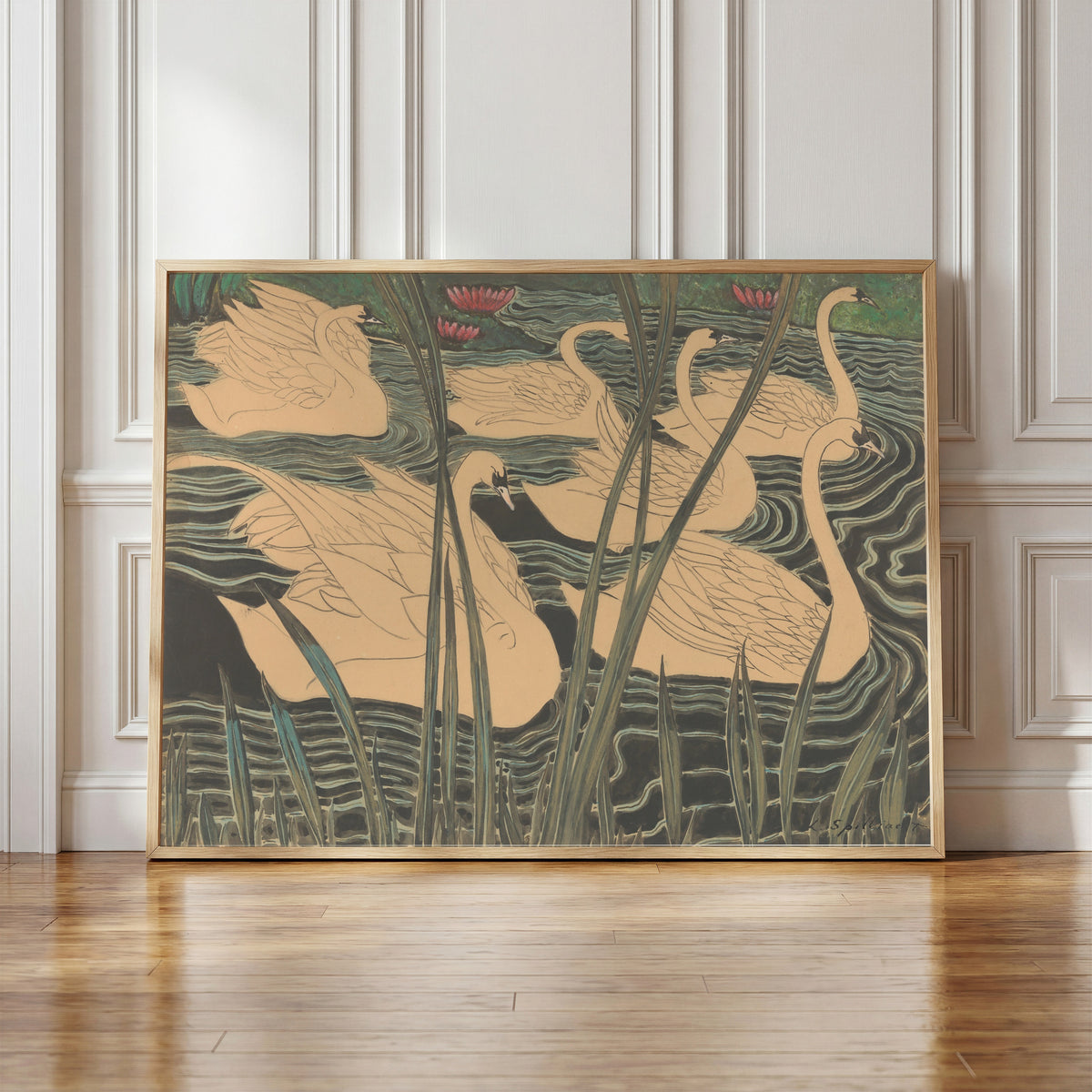 Framed art print of Zwanen by Léon Spilliaert, in a light wood frame leaning against a panelled white wall
