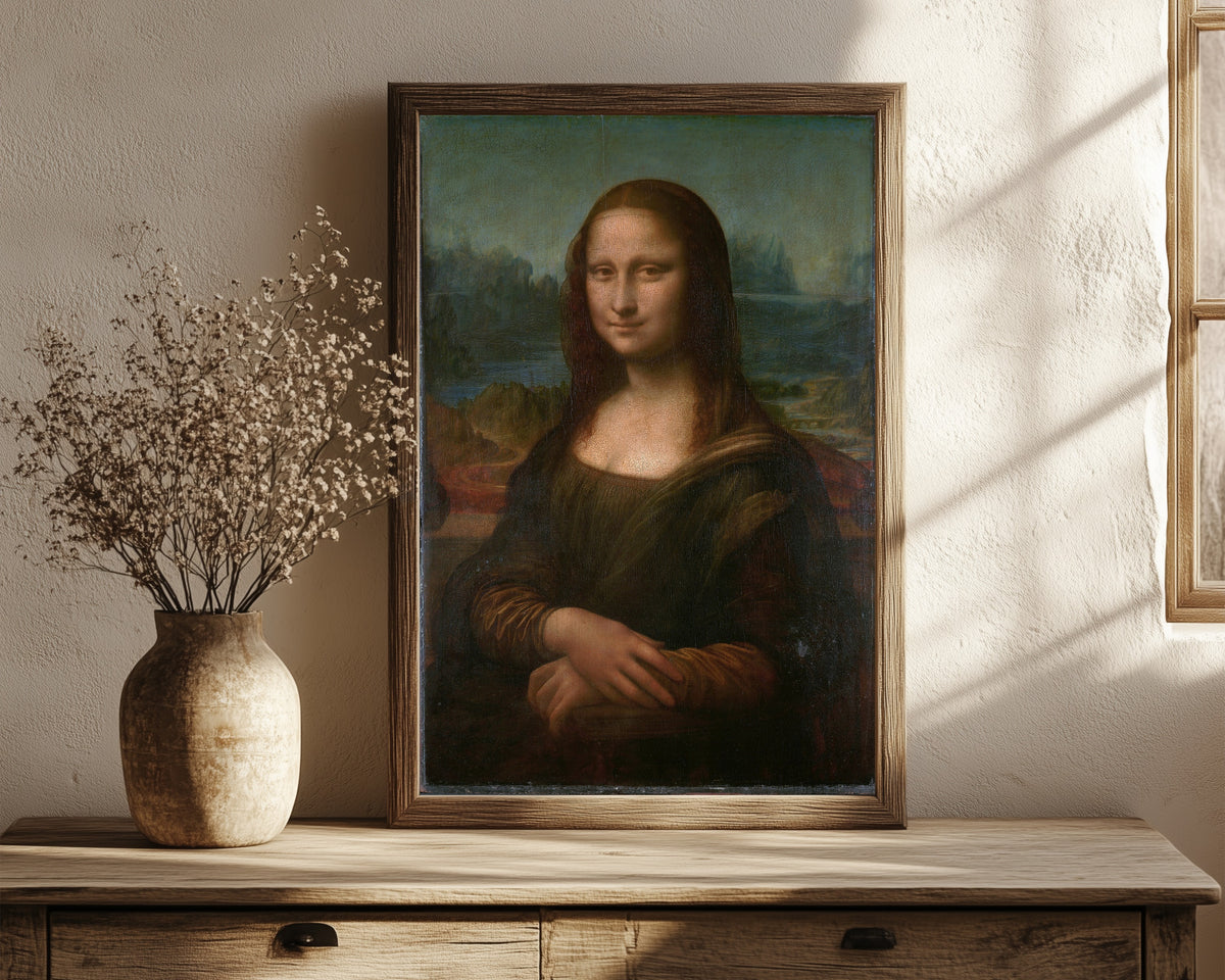 Framed art print of Mona Lisa by Leonardo da Vinci, in a dark wood frame leaning on a rustic console beside dried flowers