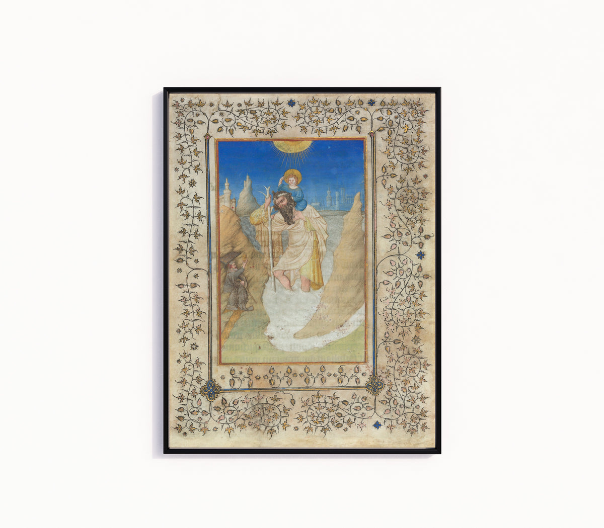 Framed art print of Saint Christopher Carrying the Christ Child by Limbourg Brothers, in a slim black frame on a plain white wall