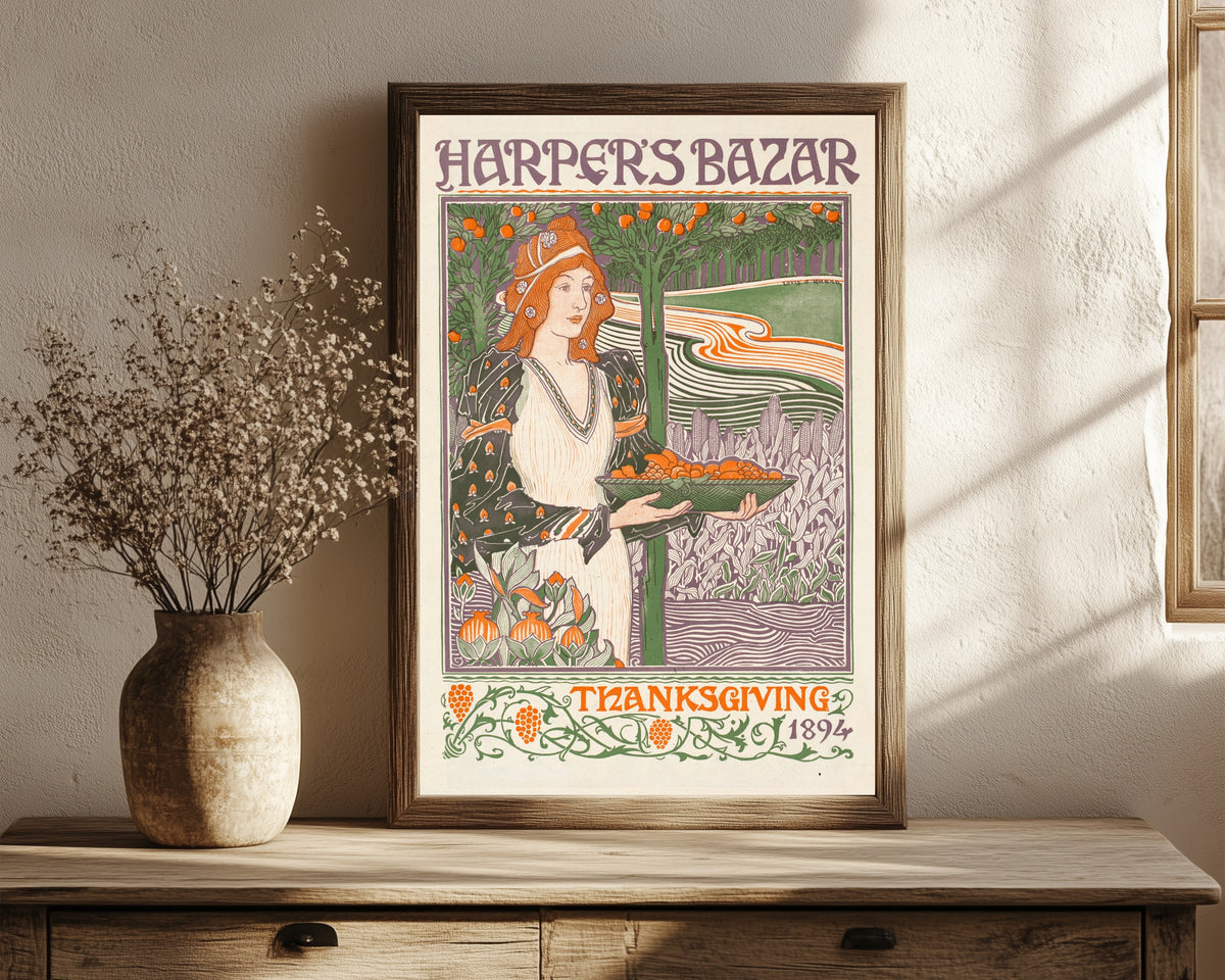 Framed art print of Harper’s Bazar, Thanksgiving 1894 by Louis Rhead, in a dark wood frame leaning on a rustic console beside dried flowers