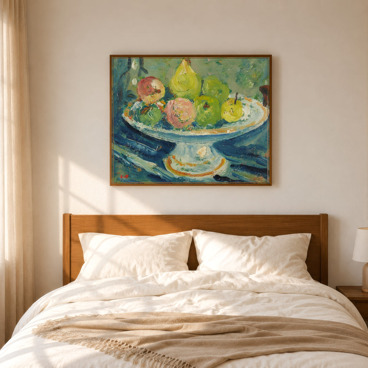 Framed art print of Le Compotier by Louis Valtat, in a slim wood frame above a bed in a sunlit bedroom