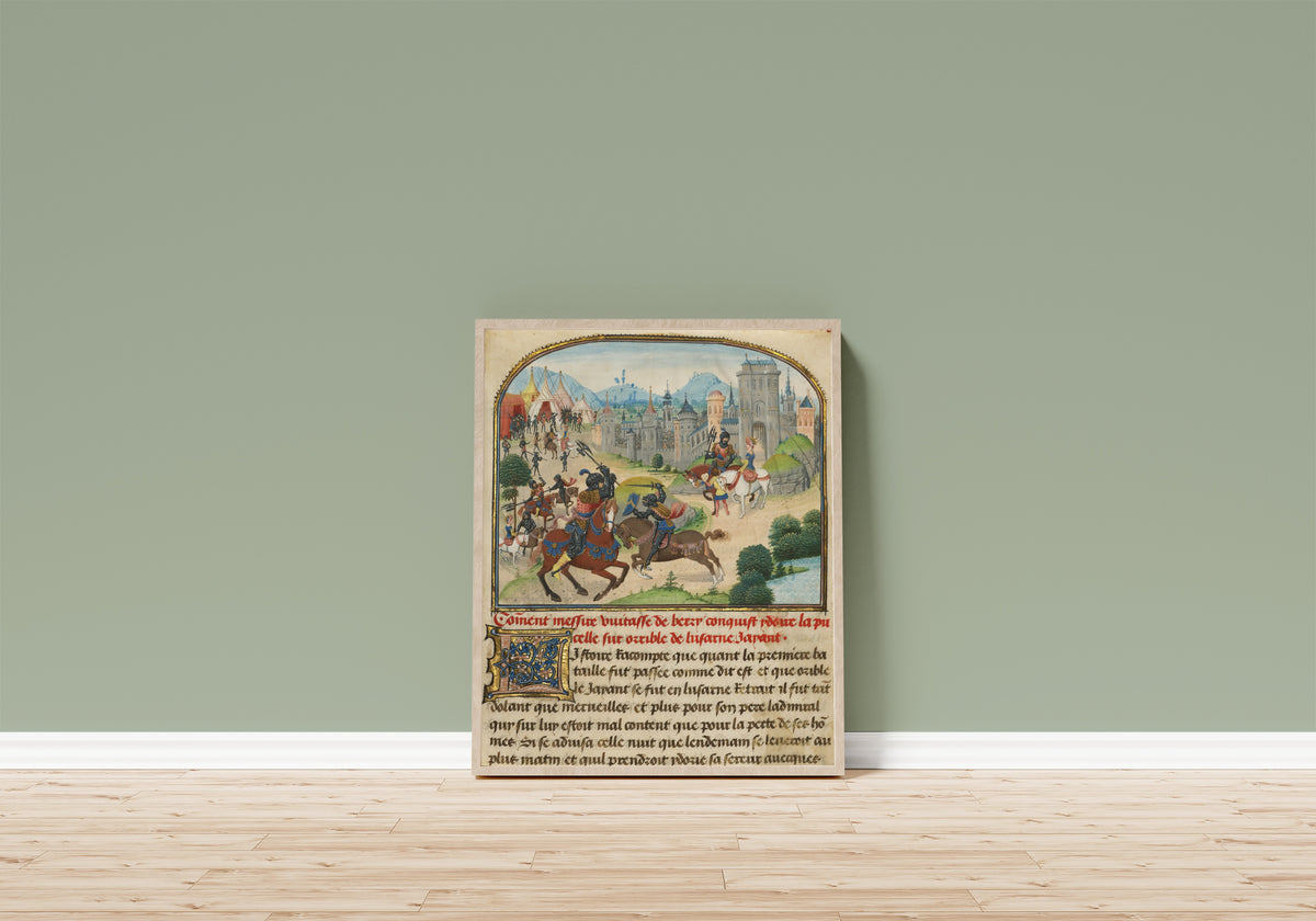 Framed art print of The Abduction of Ydoire by Loyset Liédet and Pol Fruit, in a light wood frame leaning on a sage green wall above a wooden floor
