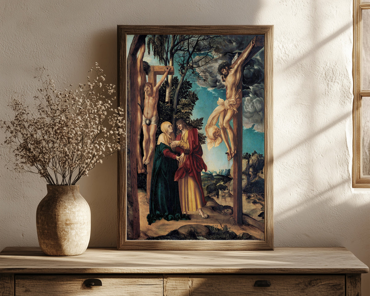 Framed art print of Lamentation under the Cross by Lucas Cranach the Elder, in a dark wood frame leaning on a rustic console beside dried flowers