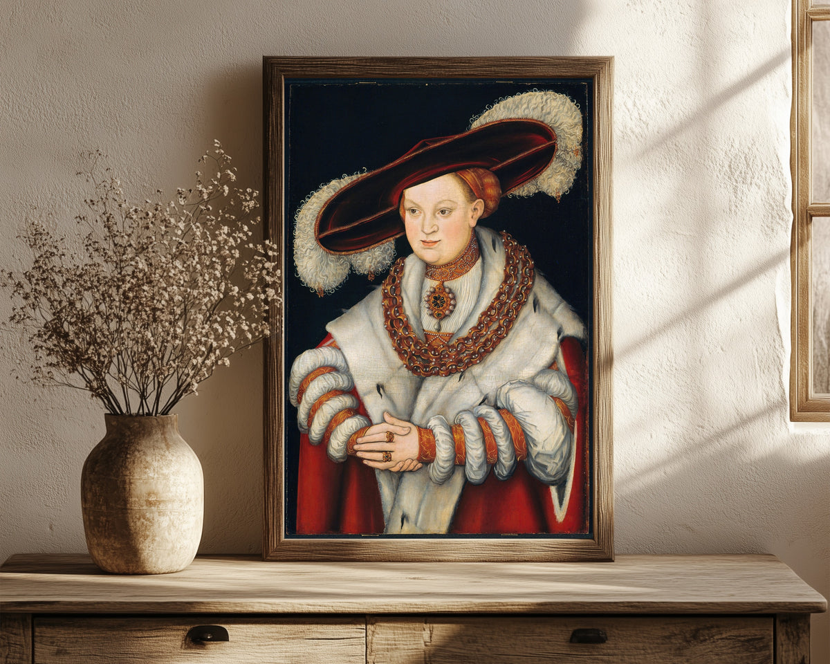 Framed art print of Portrait of Magdalena of Saxony, Wife of… by Lucas Cranach the Elder, in a dark wood frame leaning on a rustic console beside dried flowers